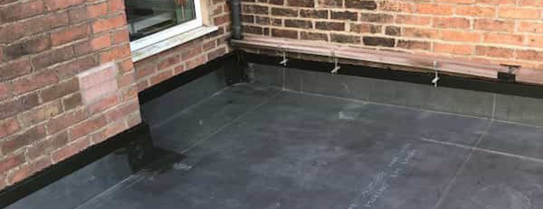 Finished installation of a EPDM rubber flat roof on a kitchen